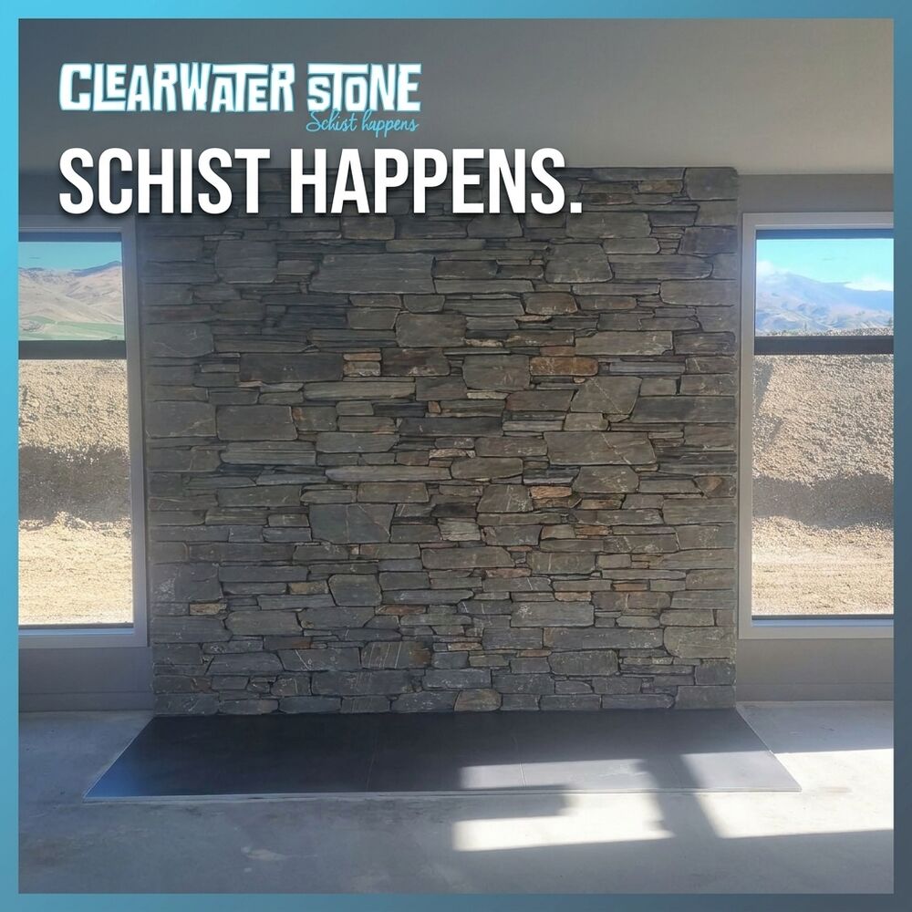 The post: the same schist wall, framed in Clearwater Stone’s slate blue with the logo and the words “Schist happens.”